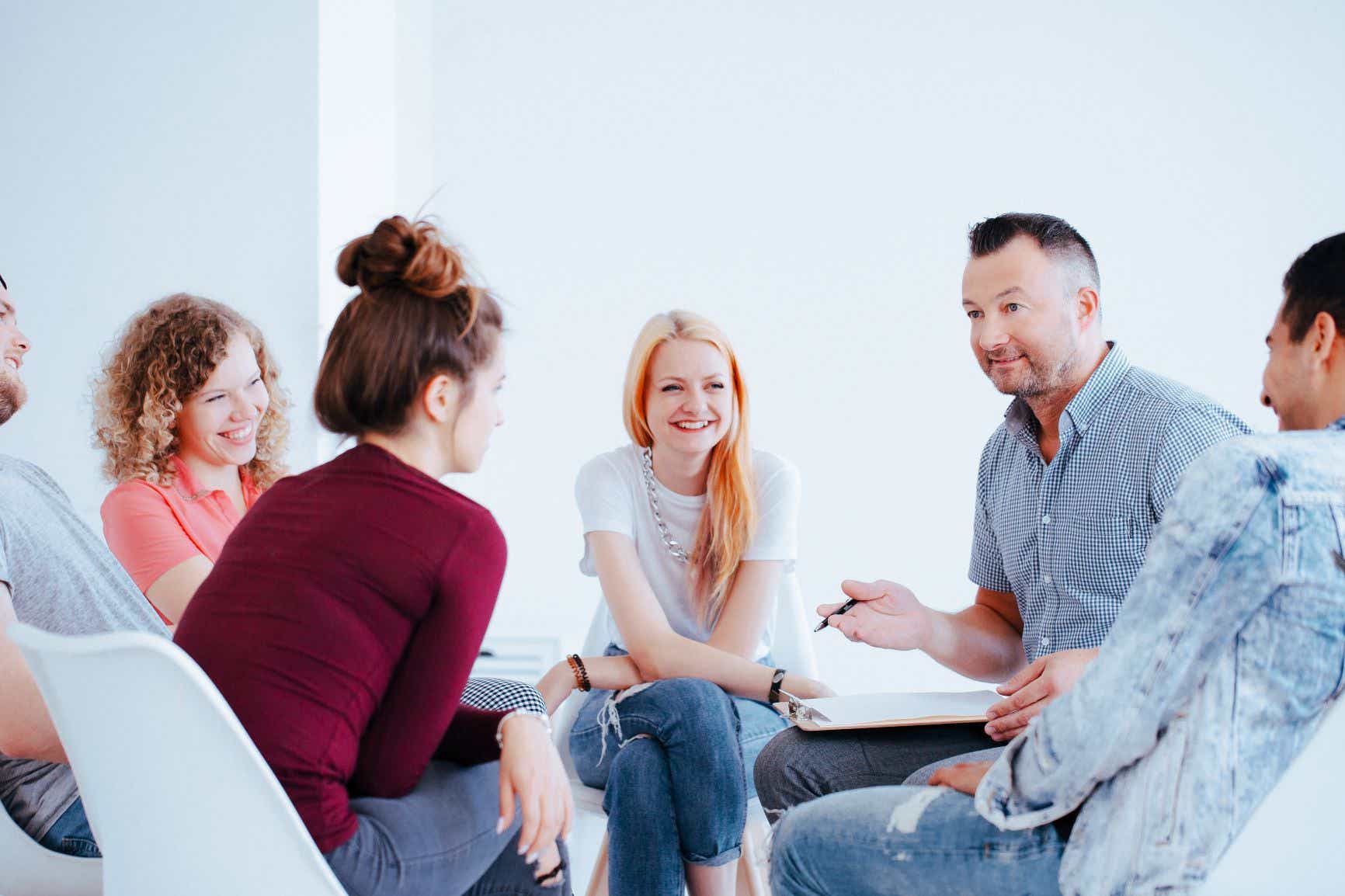 behavioural specialist talking to a group of patients